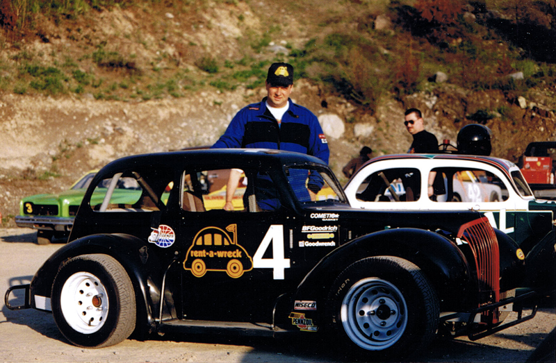 Darren Turner in the Penticton Speedway pits with the Rent a Wreck sponsored Legends Series race car